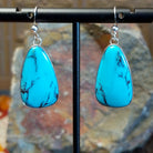 Kingman turquoise earrings by Navajo artists Everett & Mary Teller with deep burgundy matrix.
