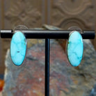 Turquoise Mountain turquoise ellipse earrings by Navajo artist Ann Curley.