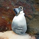 Artisan and Sterling Silver stamp on back.