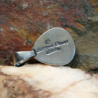 Artisan and Sterling Silver stamp on back of pendant.
