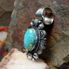 Sonoran Gold turquoise pendant by Navajo artist Rosita Calladitto, handcrafted in sterling silver, side view.