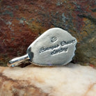 Artisan and Sterling Silver stamp on back of pendant.