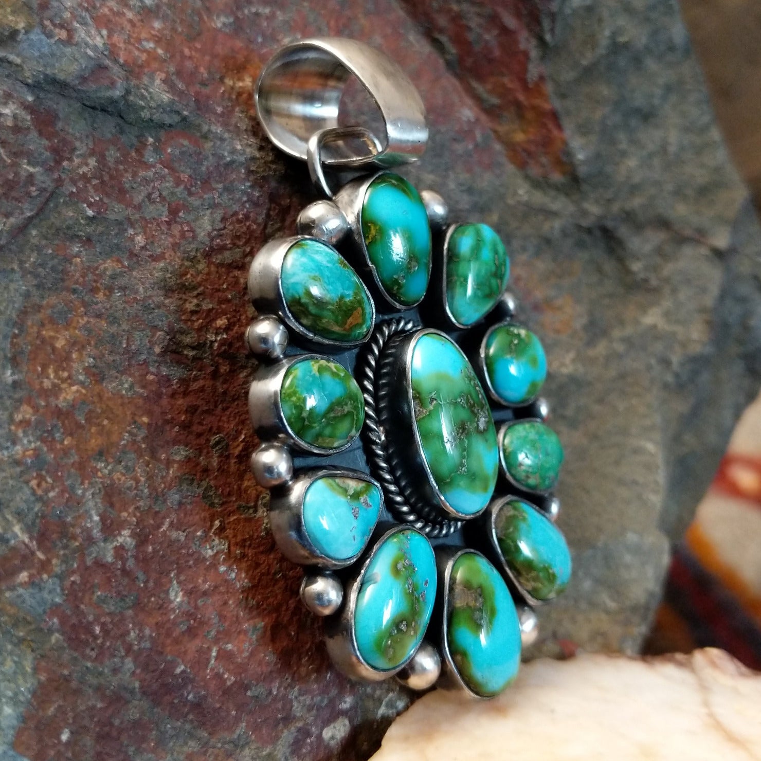 multi-stone Sonoran Gold turquoise pendant by Navajo artist Angela Martin, handcrafted in sterling silver- side view.