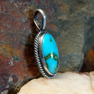  Sonoran Gold turquoise oval pendant by Navajo artist Lowell Draper, handcrafted in sterling silver with rope setting- side view.