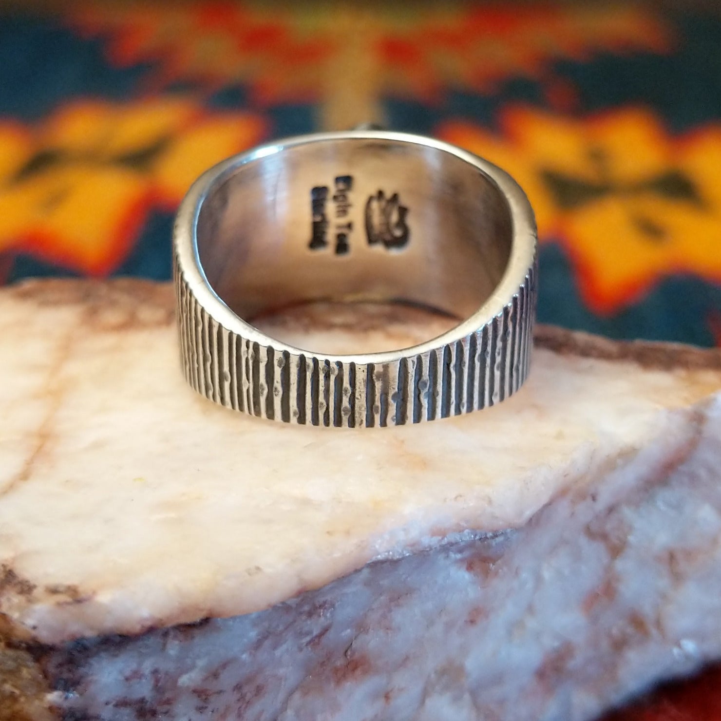 Artisan and Sterling Silver stamp on underside of ring.