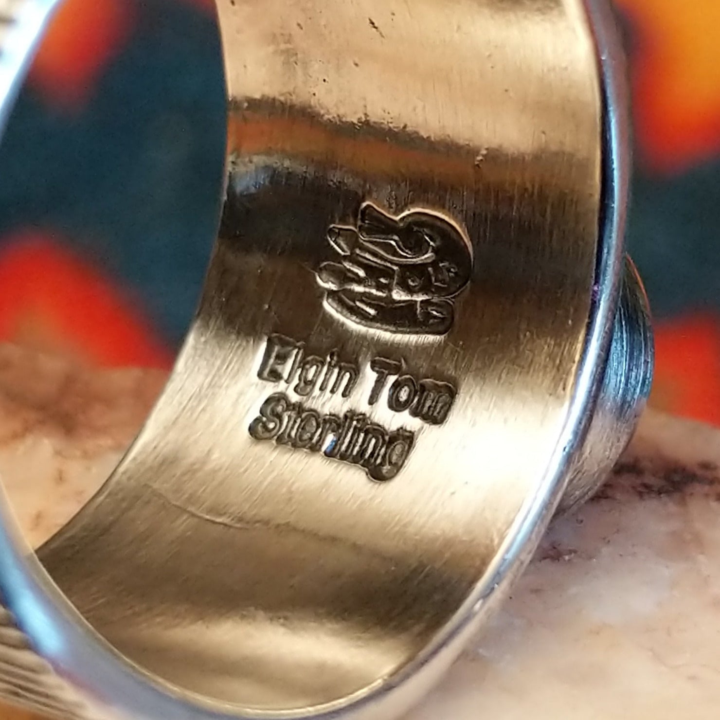 Artisan and Sterling Silver stamp on underside of ring.
