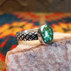 Sonoran Gold Turquoise stone in a classic circular cut, set in sterling silver. Made by Navajo Native Raymond Coriz, this ring is size 9.5, side view.