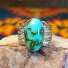 Sonoran Gold Turquoise oval stone in a strand-style setting, set in sterling silver. Made by Murphy Platero, this ring is size 8, front view.