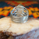 Artisan and Sterling stamp on underside of ring.