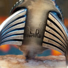 Artisan and Sterling Silver stamp on underside of ring.