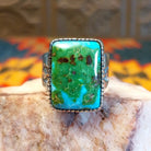  Sonoran Gold Turquoise stone in a bold rectangular cut, set in sterling silver. This Navajo-made ring is size 11, front view.