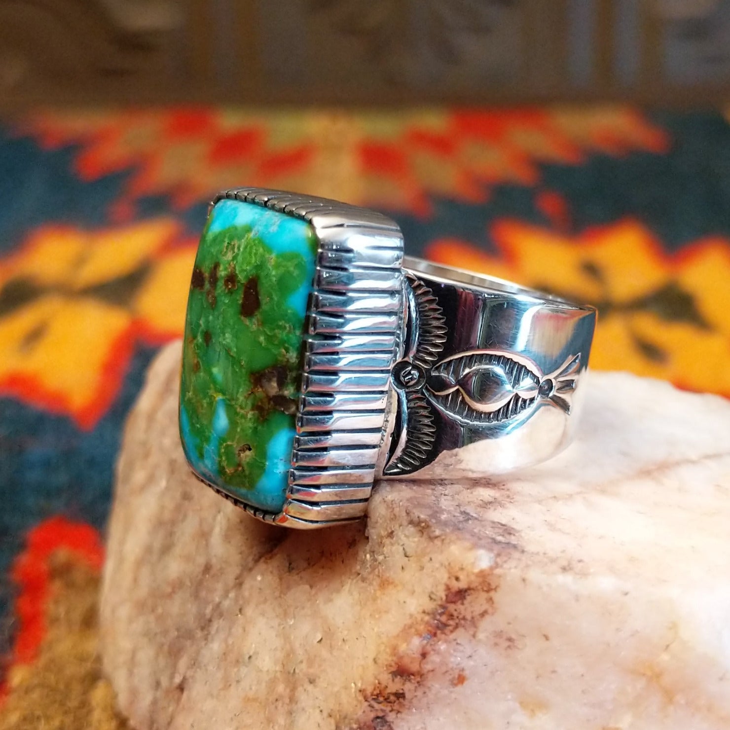  Sonoran Gold Turquoise stone in a bold rectangular cut, set in sterling silver. This Navajo-made ring is size 11, side view with band detail.