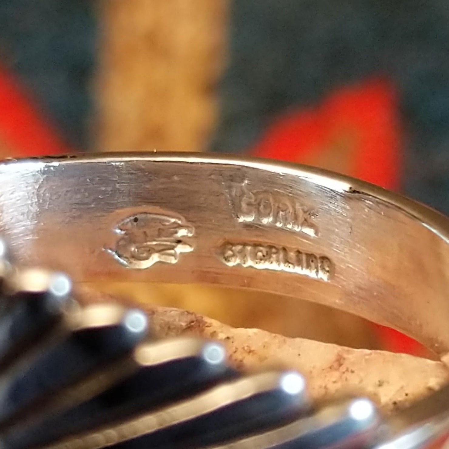 Artisan and Sterling Silver stamp on band.