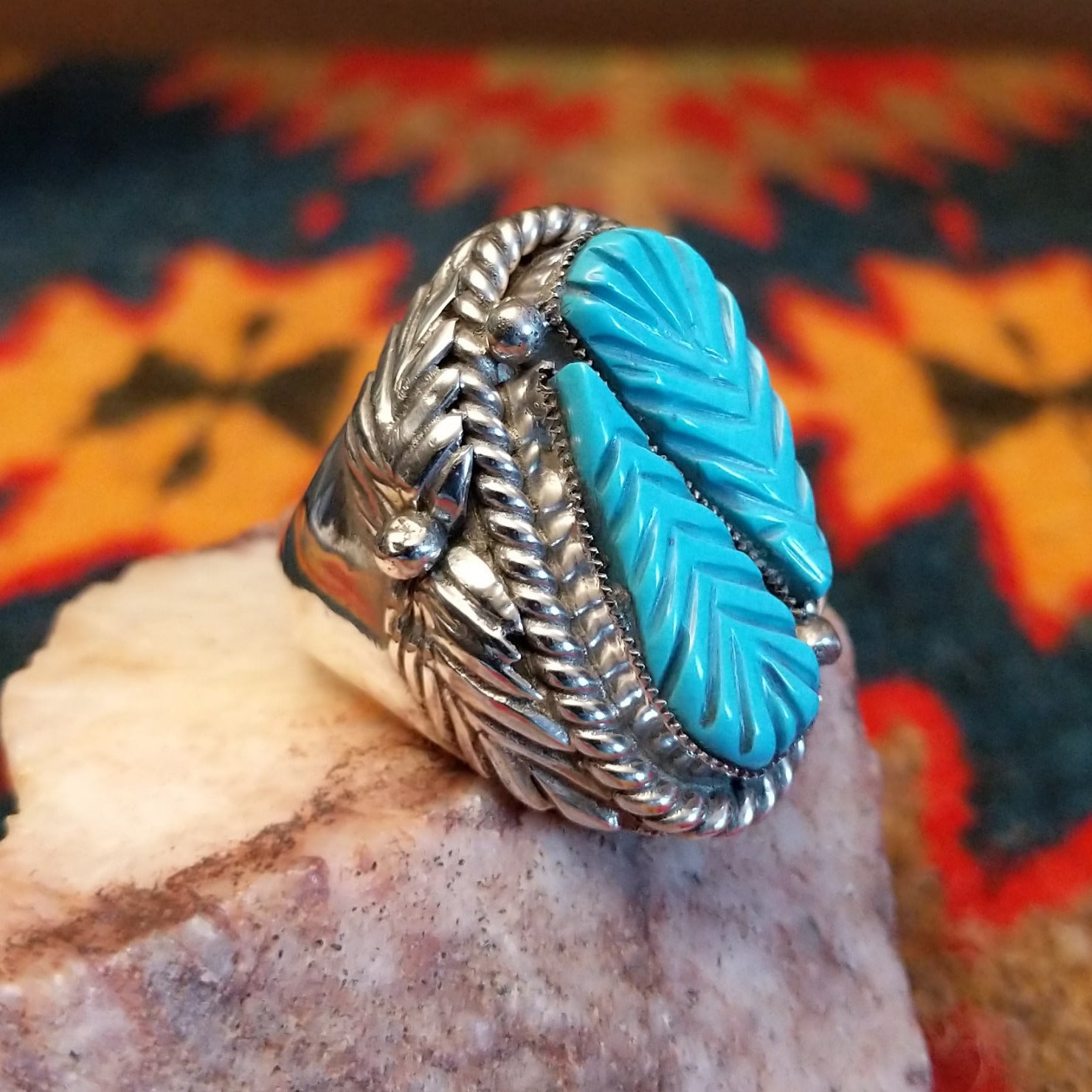  Size 9.75 Navajo ring, set in Sterling Silver, features a beautifully carved turquoise centerpiece set in sterling silver. Side view