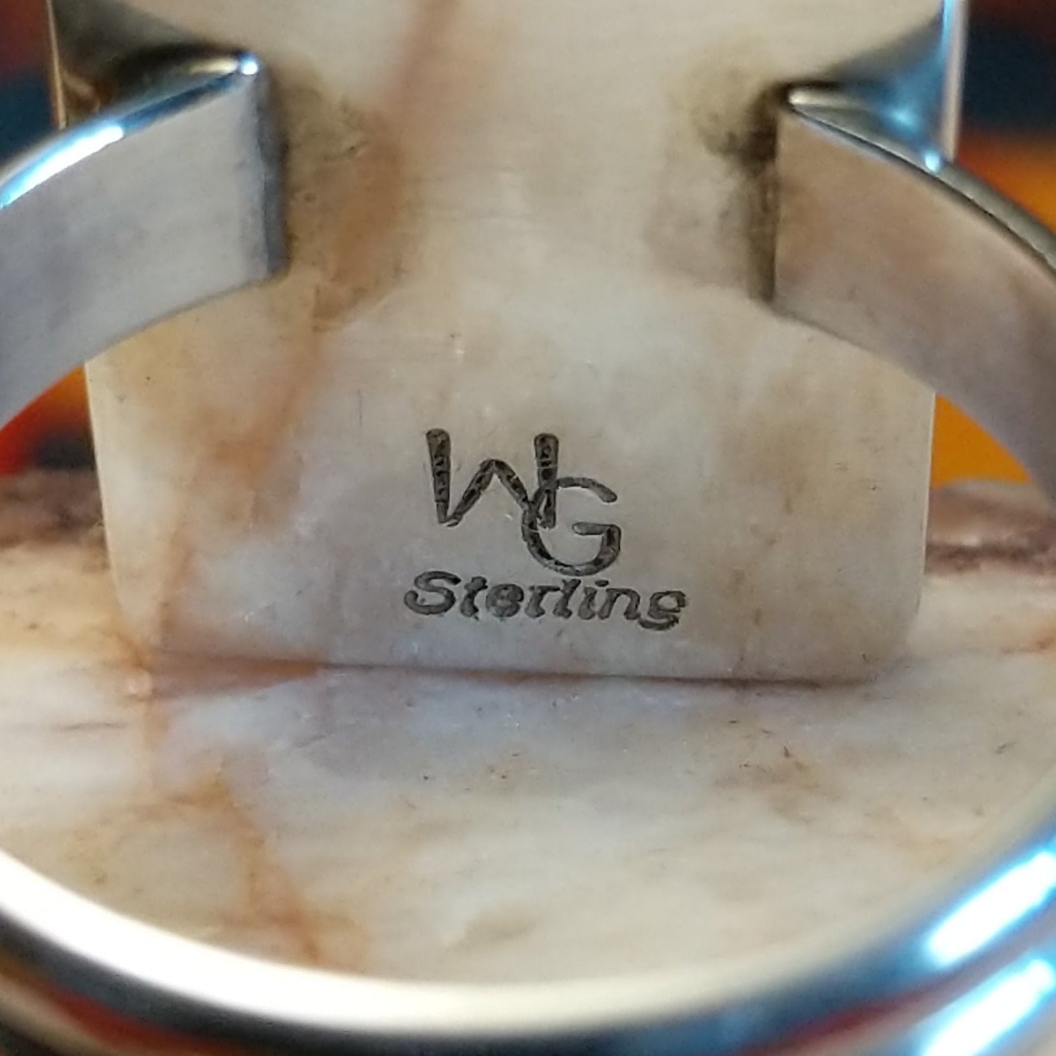 Artisan and Sterling Silver stamp on underside of ring.