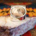Artisan and Sterling Silver stamp on underside of ring.