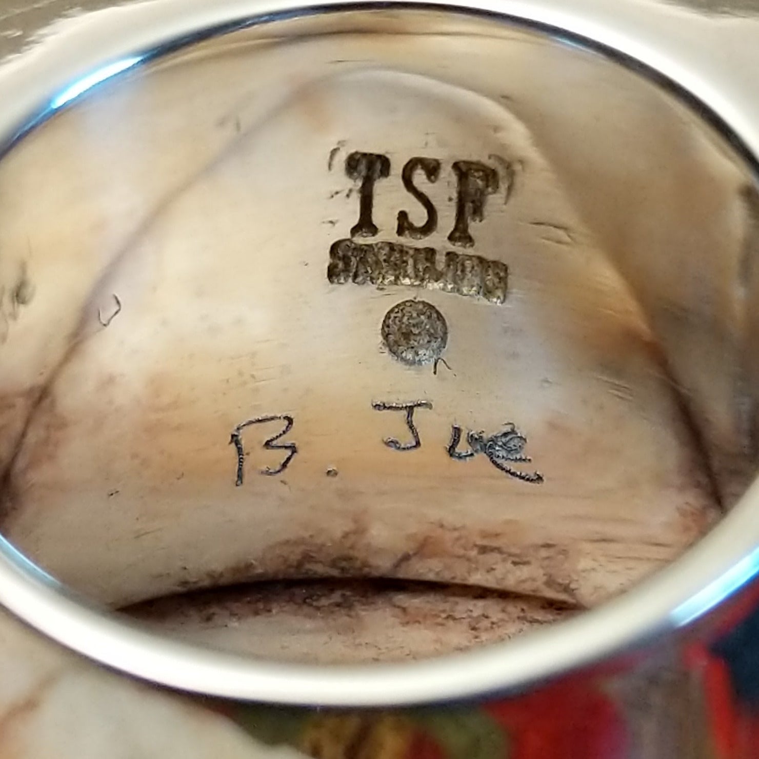 Artisan and Sterling Silver stamp on underside of ring.