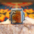 Size 11 Navajo agate ring features a striking rectangular stone set in sterling silver. Front view