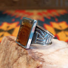 Size 11 Navajo agate ring features a striking rectangular stone set in sterling silver. Side view detail