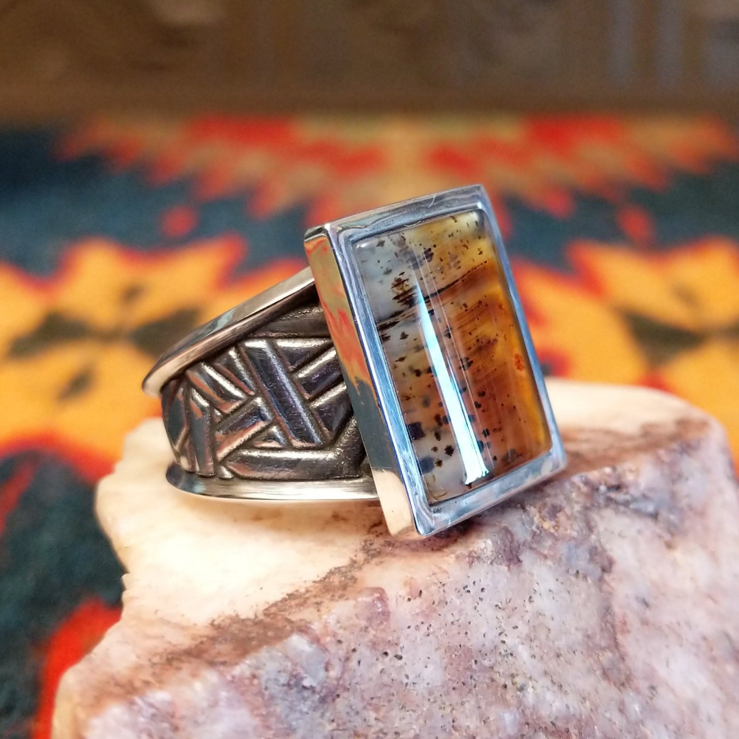 Size 11 Navajo agate ring features a striking rectangular stone set in sterling silver.  Side view detail