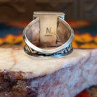 Artisan and Sterling Silver stamp on underside of ring.