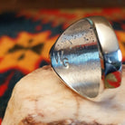 Artisan stamp on underside of ring.