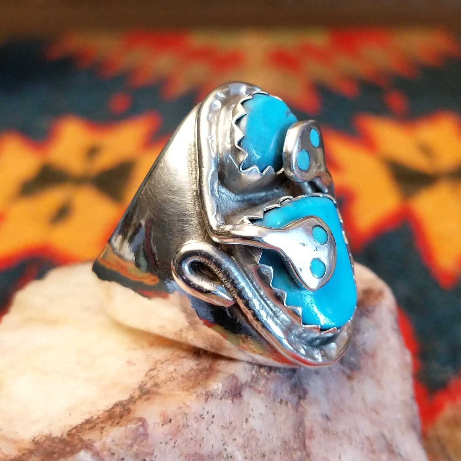 Size 12 ring by Gloria G., daughter of Effie Calavaza, beautifully carries on the iconic Zuni tradition.  Turquoise stones set in Sterling Silver. Side vew