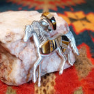 Navajo horse pendant handcrafted in sterling silver and showcases a dynamic inlay of Tiger’s Eye, Black Onyx, and Picture Jasper.  Side view