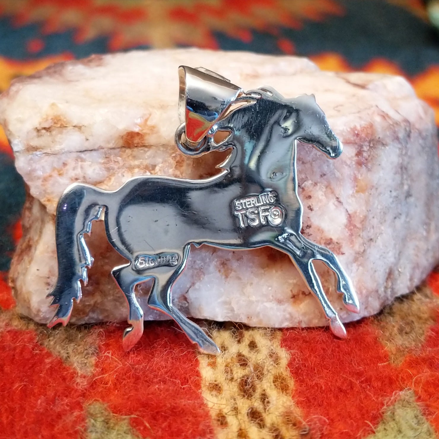 Artisan and Sterling Silver stamp on back of pendant.