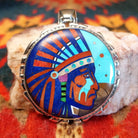 Sterling Silver Navajo “Crying Chief” Pendant featuring turquoise, lapis, mother of pearl, blue manmade opal, magnesite, and gaspeite.  Front view