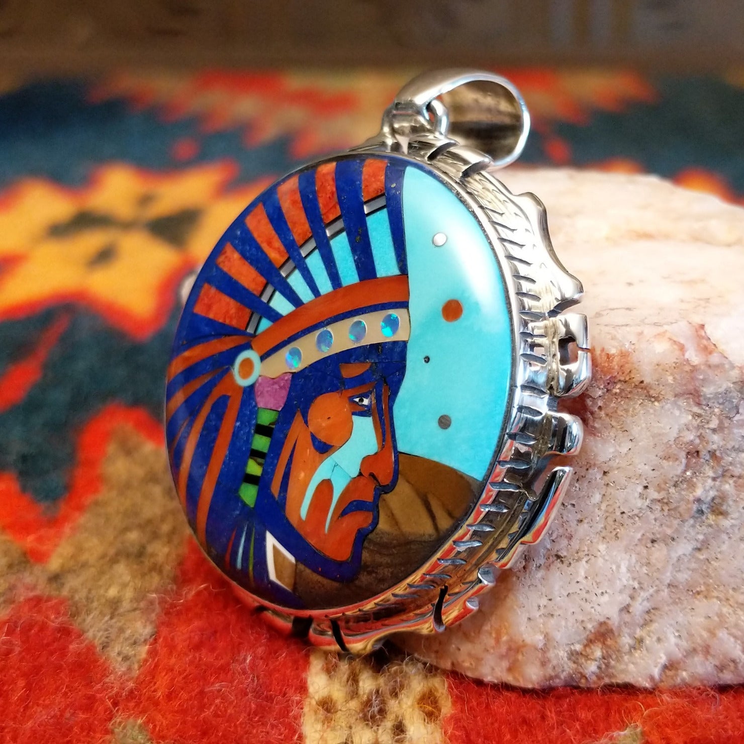 Sterling Silver Navajo “Crying Chief” Pendant featuring turquoise, lapis, mother of pearl, blue manmade opal, magnesite, and gaspeite.  Side view