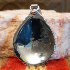Artisan and sterling silver .925 stamp on back of pendant.