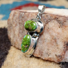 Sterling silver pendant with arranged Sonoran Gold turquoise stones displaying blue-green hues and natural golden matrix, handcrafted by artisan L.P.  Side View