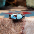 Navajo sterling silver ring with an oval Golden Hills turquoise stone and twisted silver band in a classic Southwestern design.  Front view.