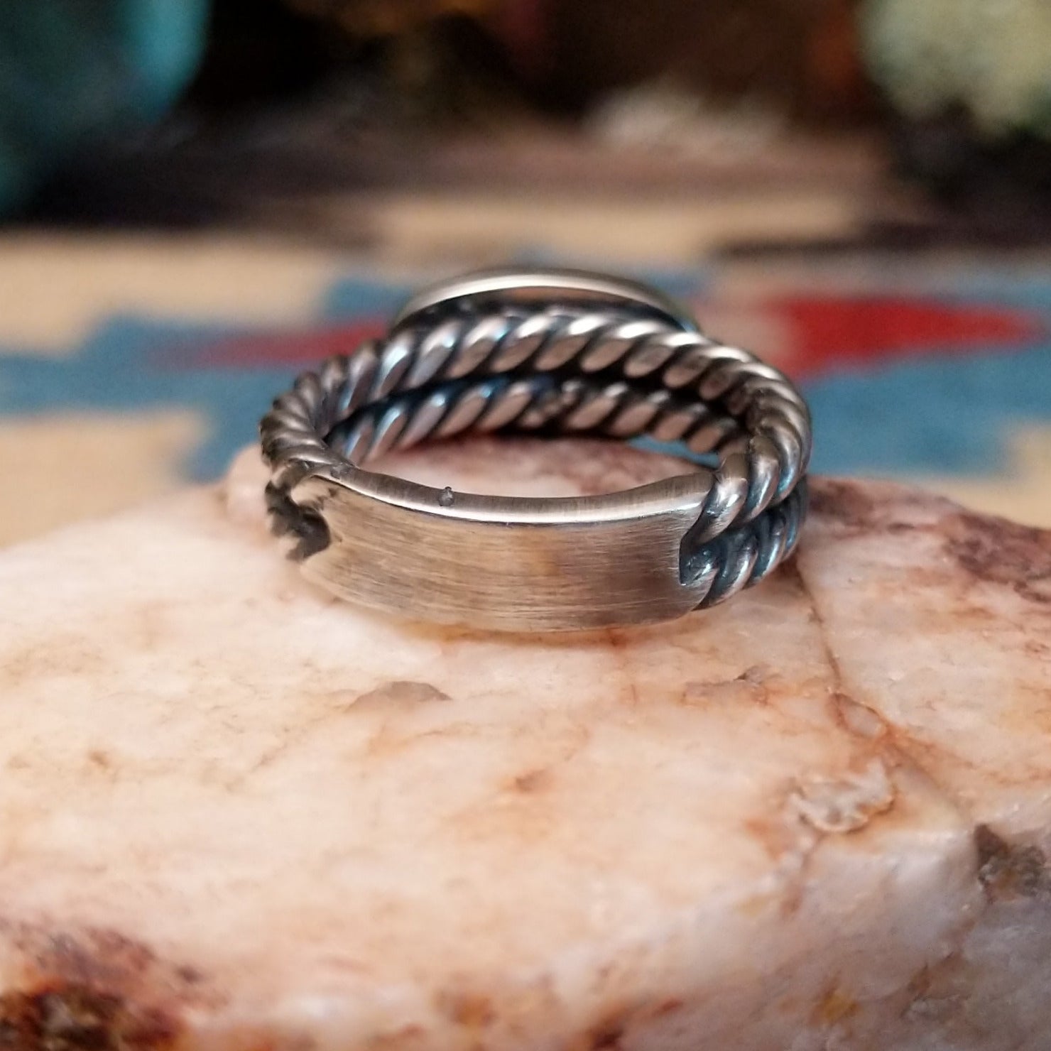 Navajo sterling silver ring with an oval Golden Hills turquoise stone and twisted silver band in a classic Southwestern design. Bottom view