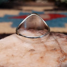 Navajo sterling silver ring with an oval Wild Horse stone featuring natural white and brown patterns in a classic Southwestern design.  Underside view.