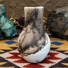 Medium-sized white horsehair chiminea-style vase by local artist Jim Calhoun with smoky natural markings, polished finish, and handcrafted Southwestern design.