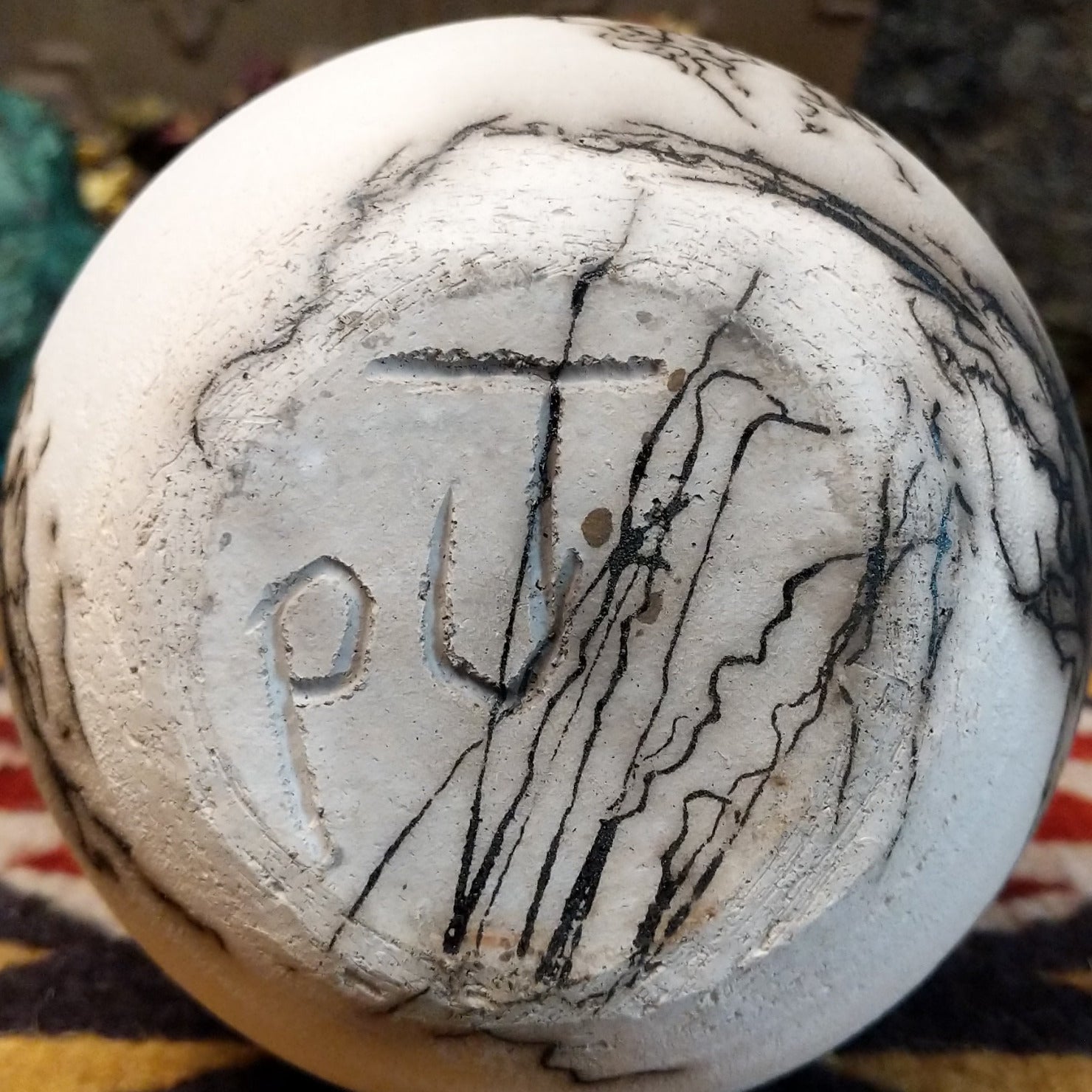 Medium-sized white horsehair chiminea-style vase by local artist Jim Calhoun with smoky natural markings, polished finish, and handcrafted Southwestern design.  Underside view with artist initials.
