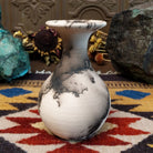 Small flared white horsehair pottery vase by local artist Jim Calhoun featuring smoky organic patterns, polished finish, and handcrafted Southwestern style.