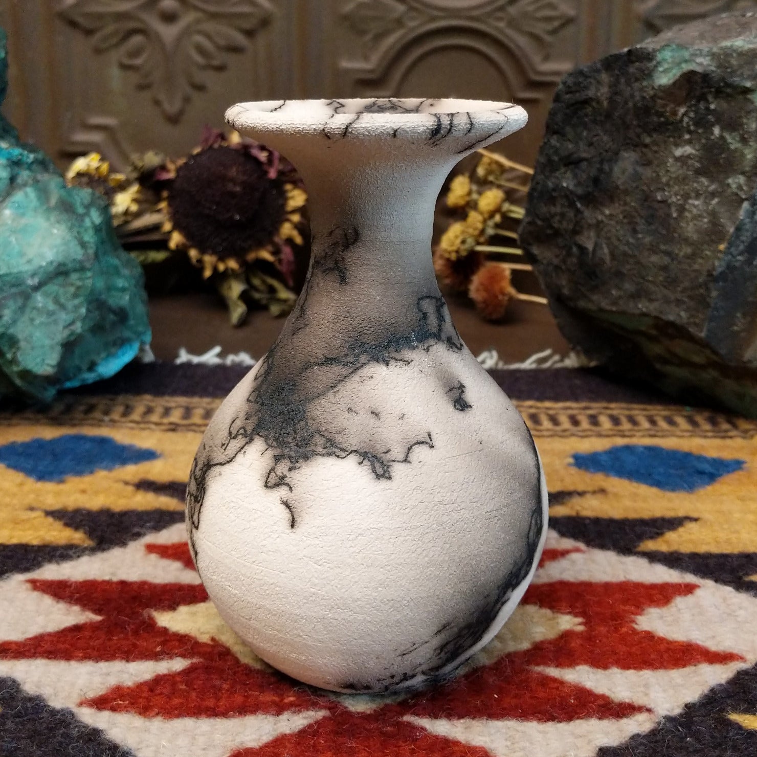 Small flared white horsehair pottery vase by local artist Jim Calhoun featuring smoky organic patterns, polished finish, and handcrafted Southwestern style.