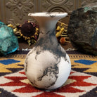 Small flared white horsehair pottery vase by local artist Jim Calhoun featuring smoky organic patterns, polished finish, and handcrafted Southwestern style.