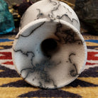 Small flared white horsehair pottery vase by local artist Jim Calhoun featuring smoky organic patterns, polished finish, and handcrafted Southwestern style.  Top view.