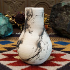 Small chiminea-style white horsehair pottery vase by local artisan Jim Calhoun with smoky natural patterns, polished finish, and handcrafted Southwestern design.
