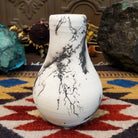 Small chiminea-style white horsehair pottery vase by local artisan Jim Calhoun with smoky natural patterns, polished finish, and handcrafted Southwestern design.