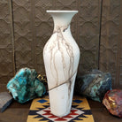 Tall flared white horsehair pottery vase by local artisan Jim Calhoun featuring smoky black organic patterns, polished white finish, and handcrafted Southwestern design.