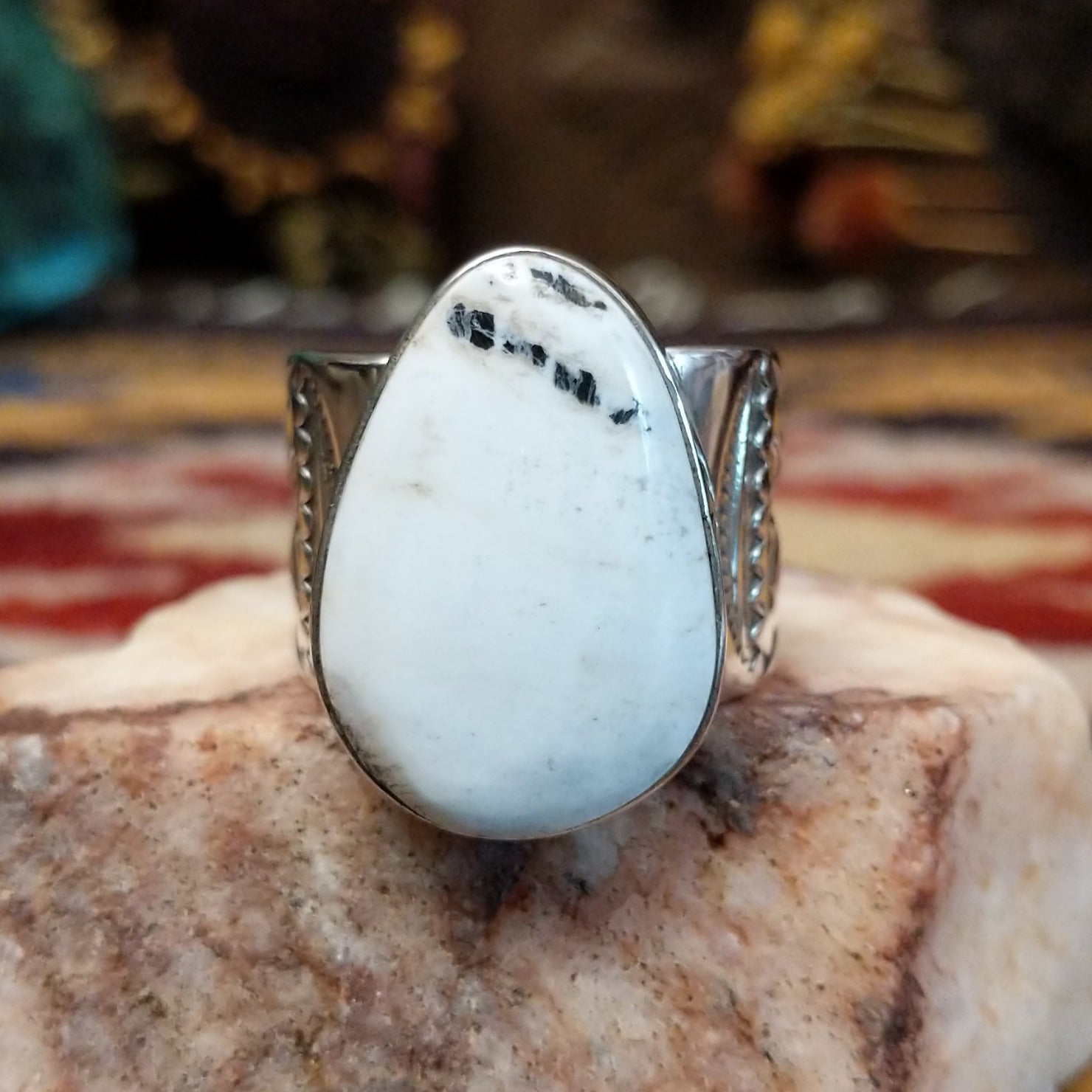 Sterling silver Navajo ovoid ring by L.P. featuring a polished White Buffalo stone set in a traditional handcrafted bezel. 