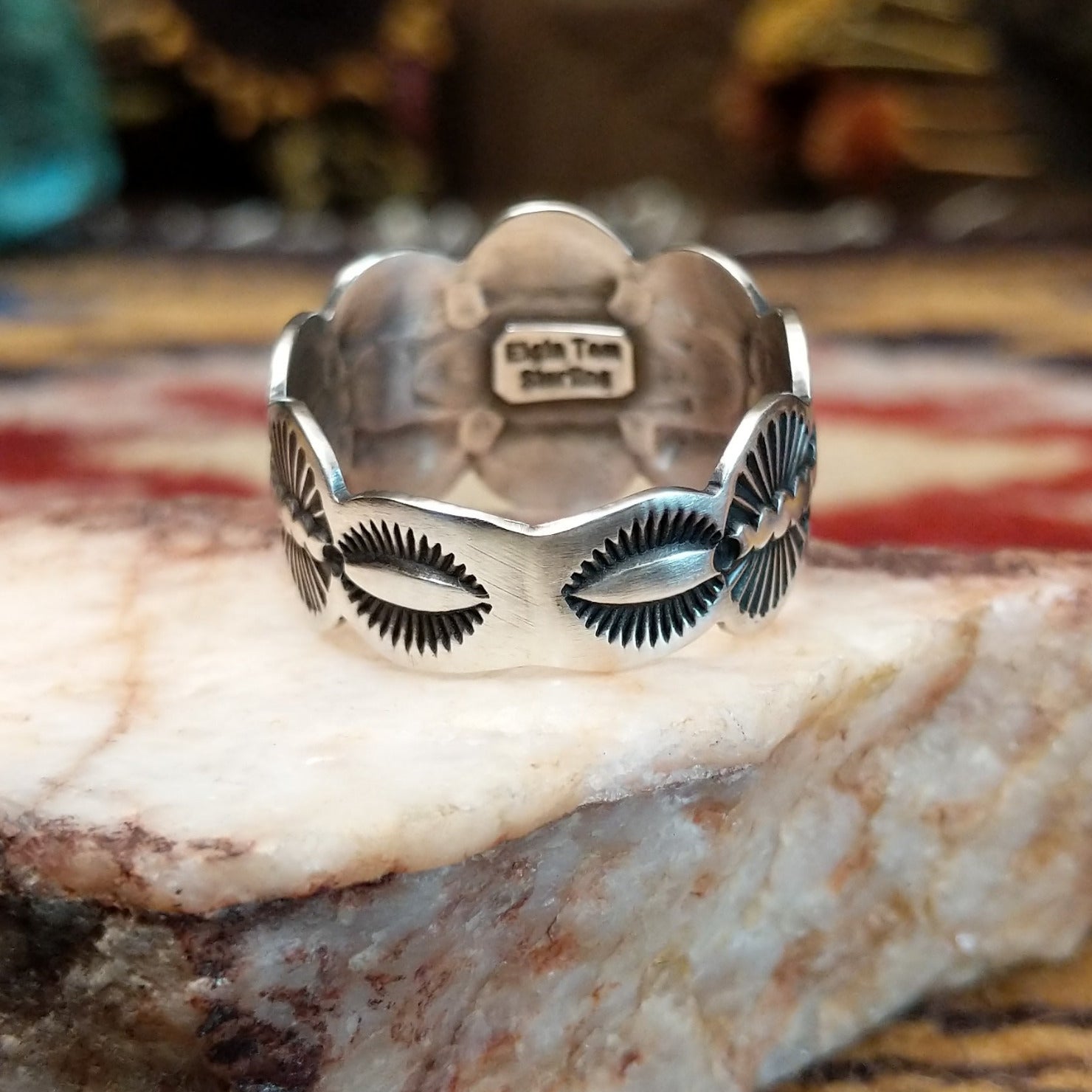 Handcrafted sterling silver scalloped ring by Elgin Tom featuring a polished finish and curved scalloped edges in a traditional Southwestern design.  Underside of ring.