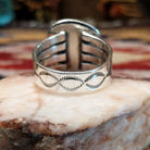 Handcrafted Navajo sterling silver ring by L.P. featuring a natural turquoise stone with traditional Southwestern silver detailing and a polished finish.  Underside view.