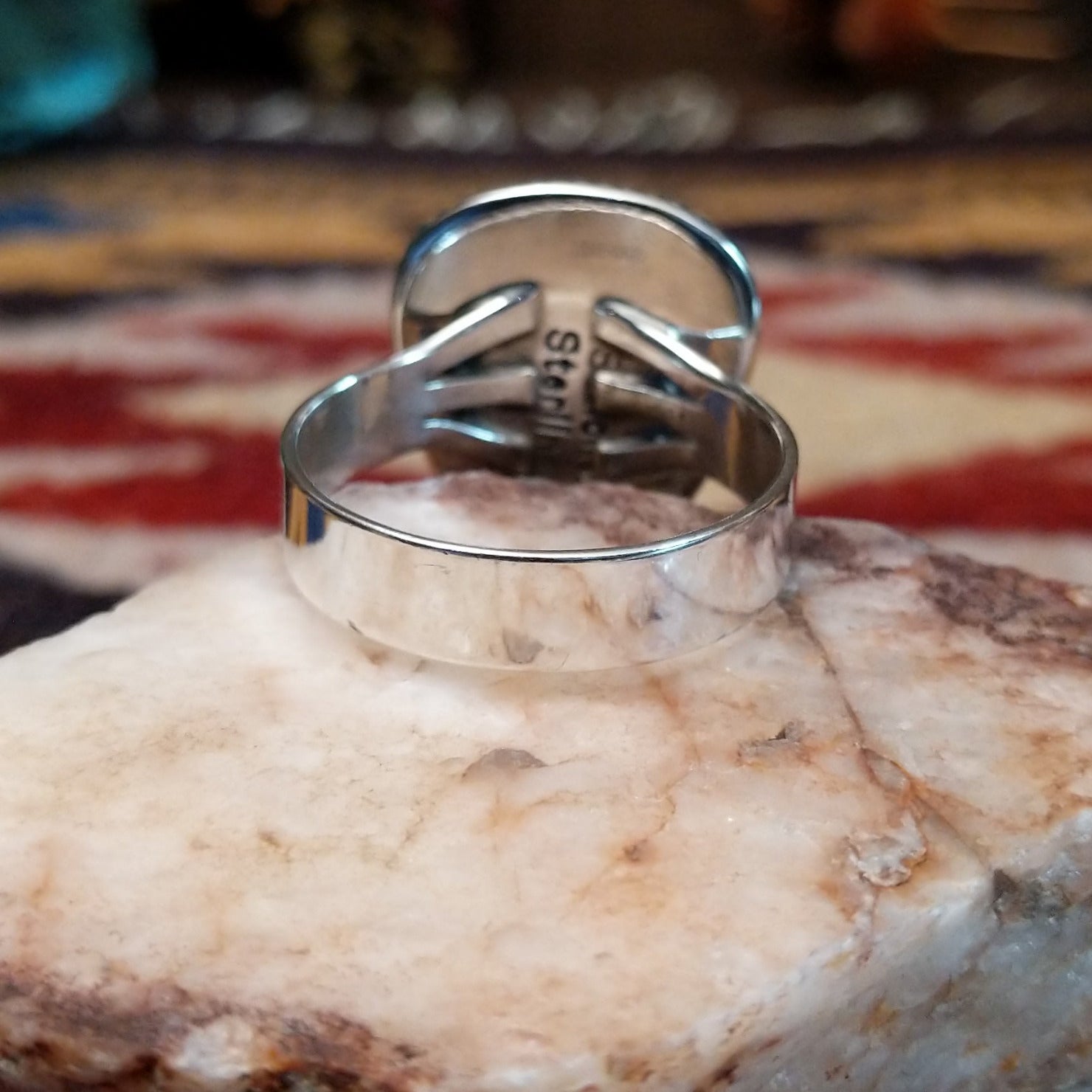 Handcrafted sterling silver ring by S.R. Chee featuring a triangular turquoise stone with traditional Southwestern Native American silver detailing.  Underside view.