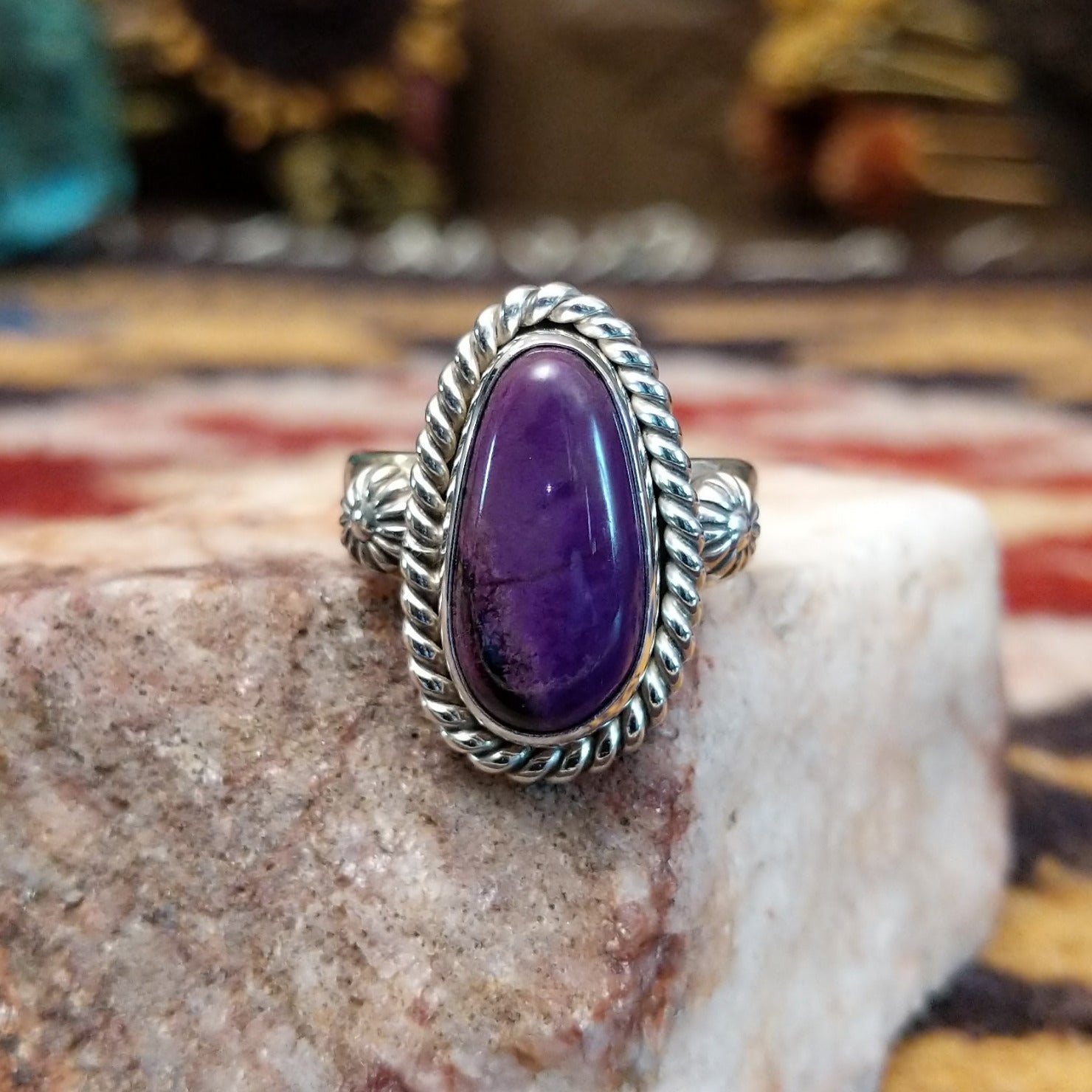 Handcrafted sterling silver ovoid ring by Artie Yellowhorse featuring a deep purple sugilite stone in a polished Southwestern Native American design.